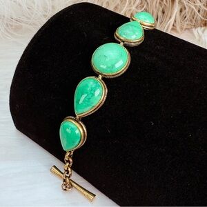 Gorgeous, aged goldtone Green accent, weighted bracelet, toggle closure Bracelet